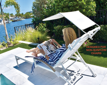 A woman sitting in a non SUNFLOW chair with her Universal Sun Shade attached.